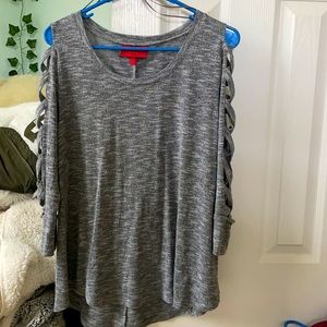 Jennifer Lopez gray white crisscross arm detail